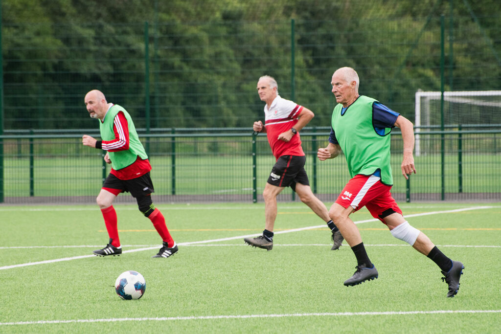 older-people-playing-football-after-implantable-lenses